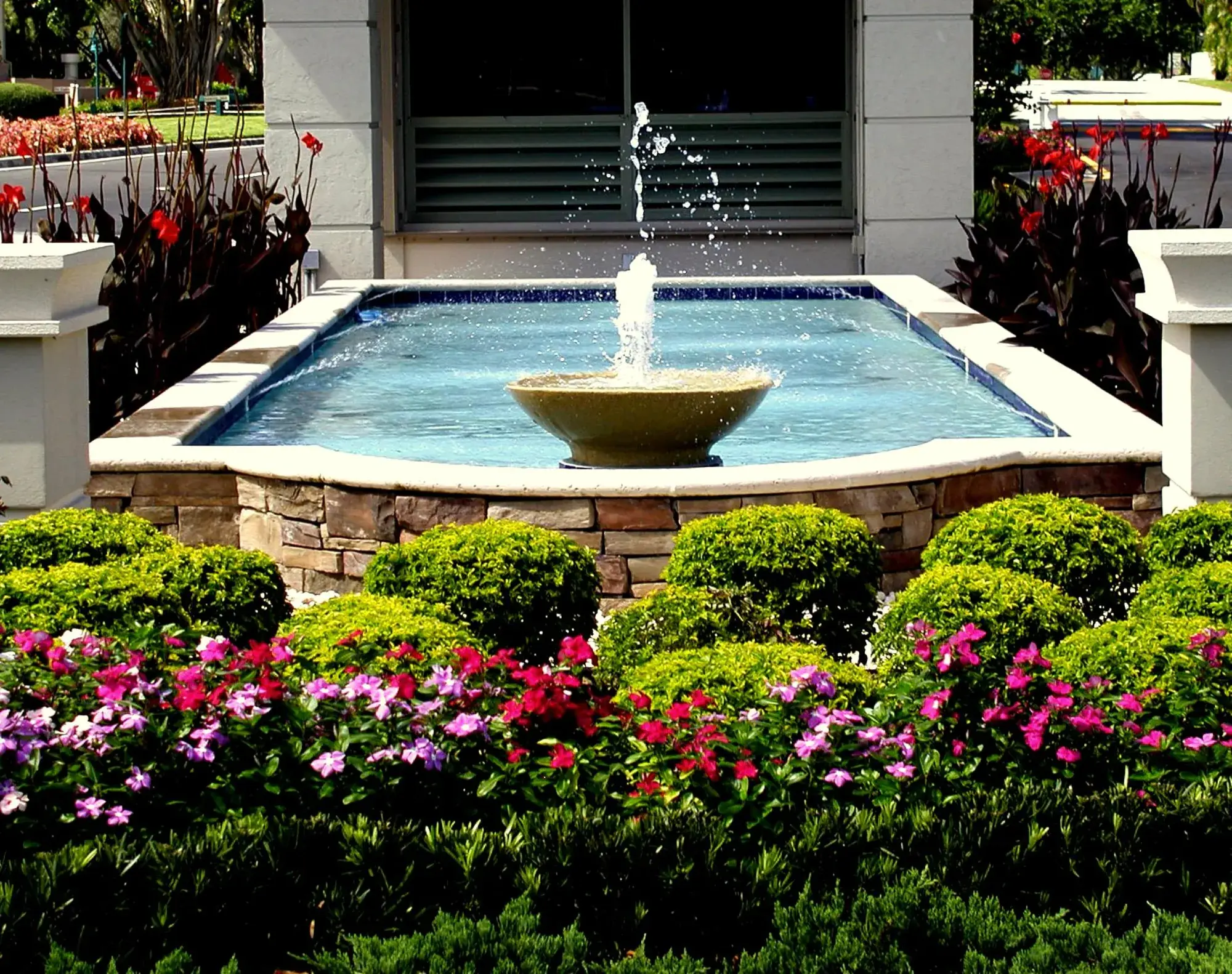 Guardhouse and reflecting pool at the property entrance