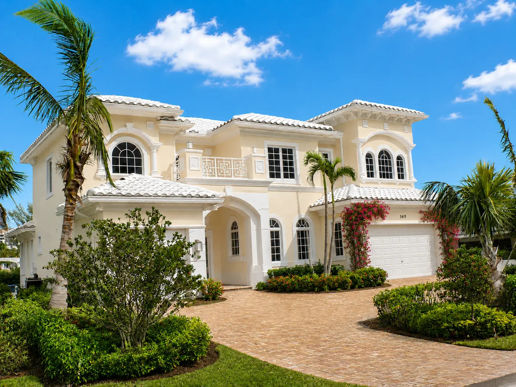 Two-story residence with paver driveway