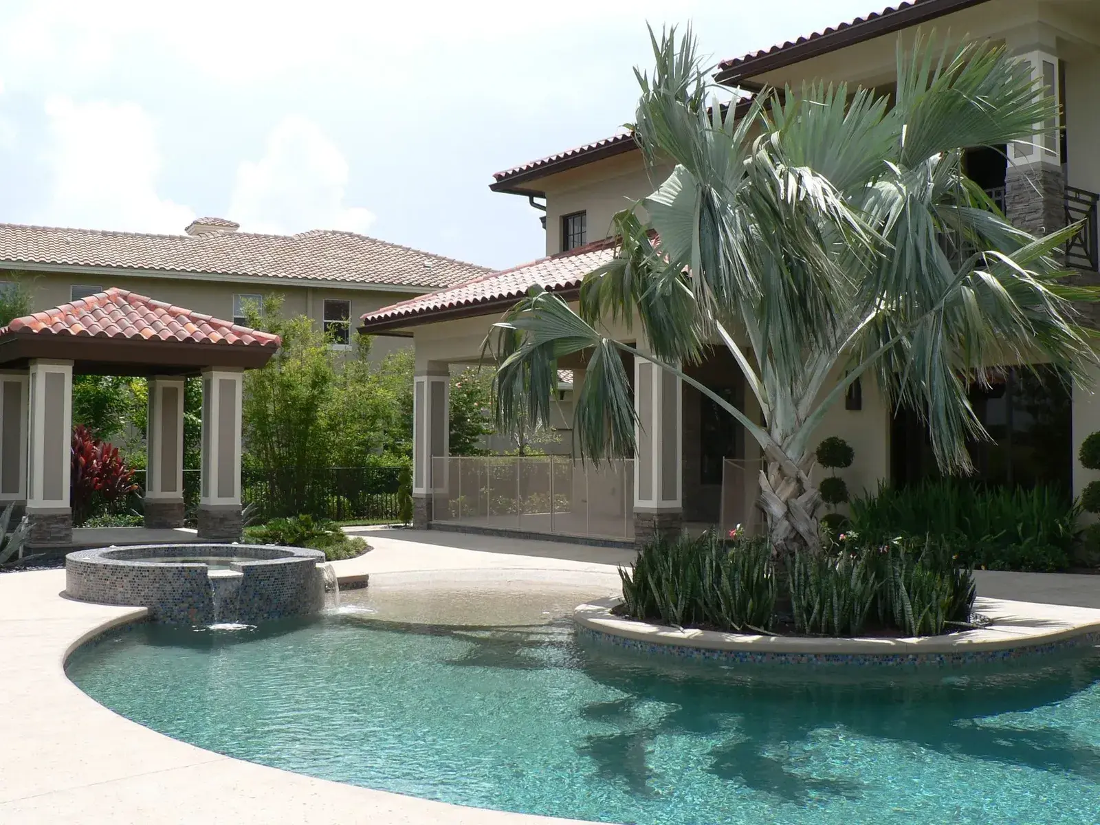 Pool and spa alongside a covered lanai