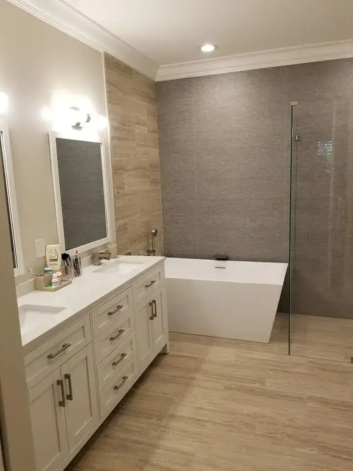 Master bathroom with freestanding tub and full-height glass shower