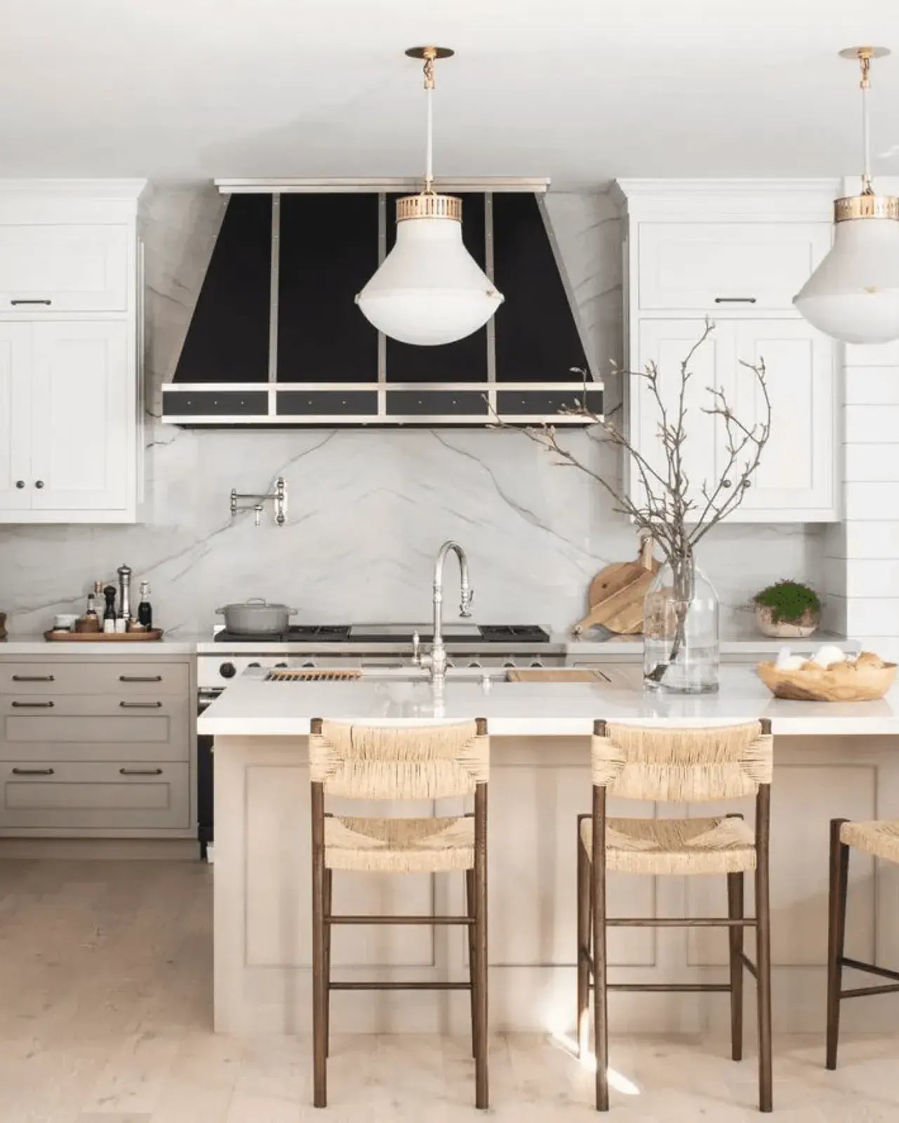 Modern white kitchen with black range hood